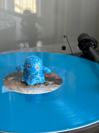 Blue Vinyl Ghost collectible figure on a blue coloured vinyl turntable setup