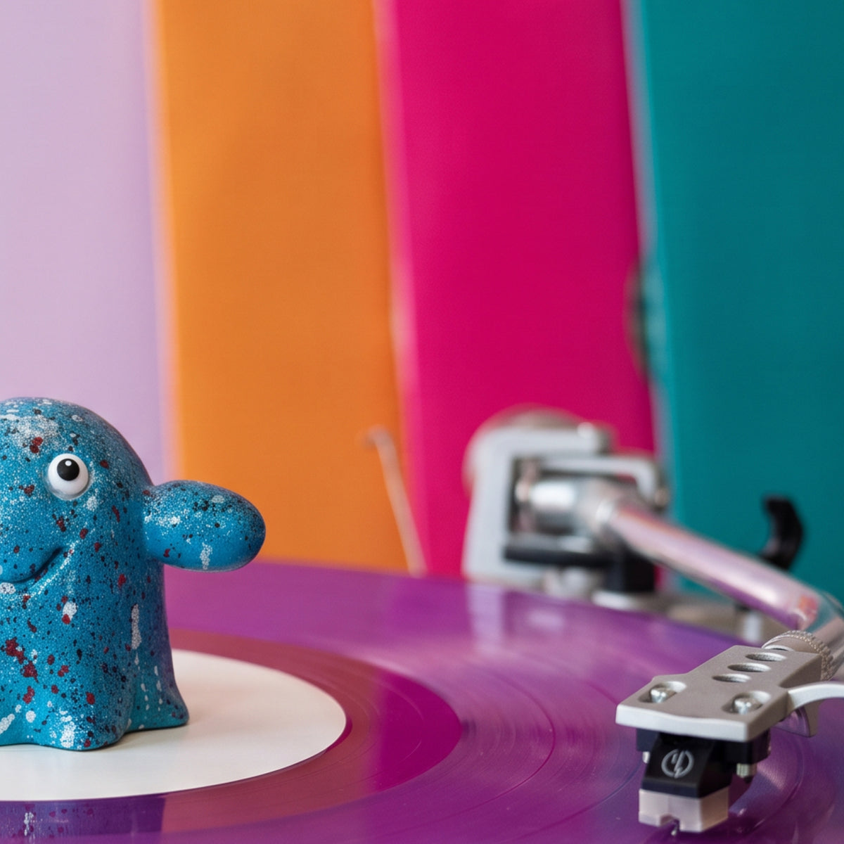Close-up of the hand-painted splatter finish on the Series 002 Vinyl Ghost